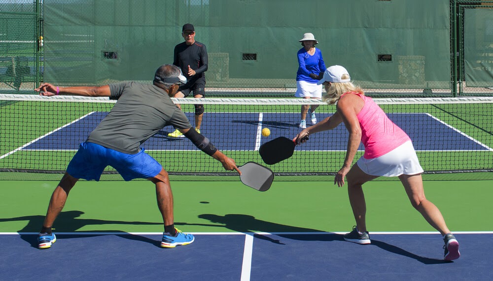 Four Pickleball players on court