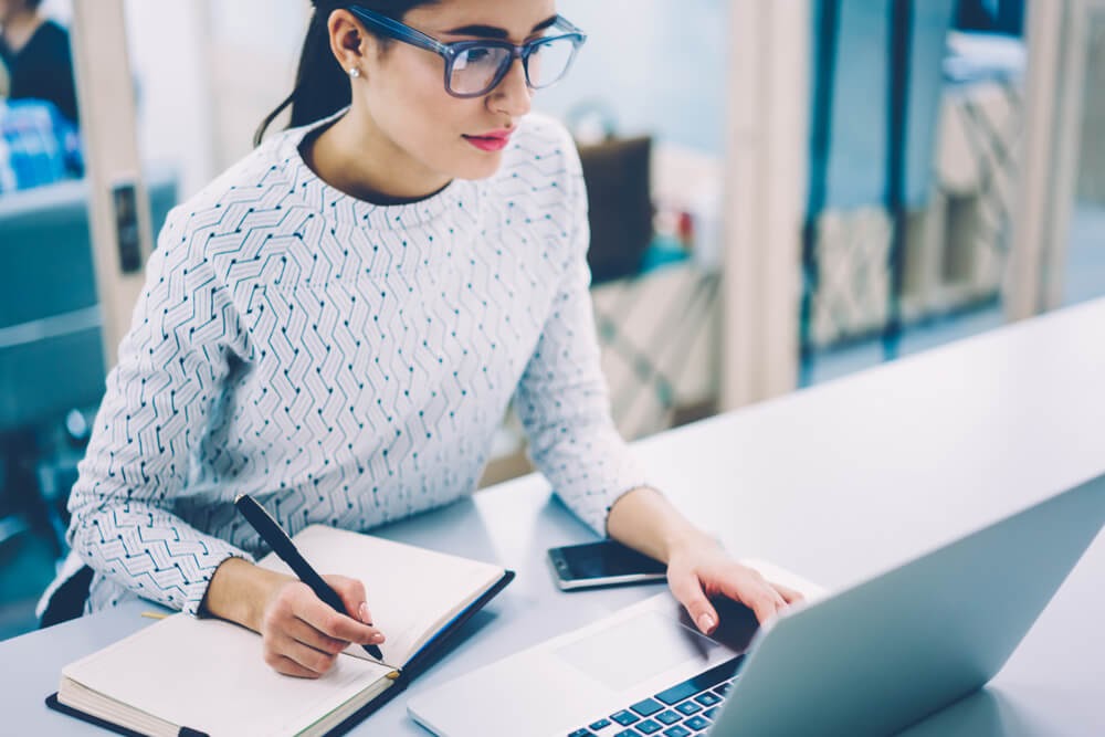 Fabulously dressed woman working on her computer