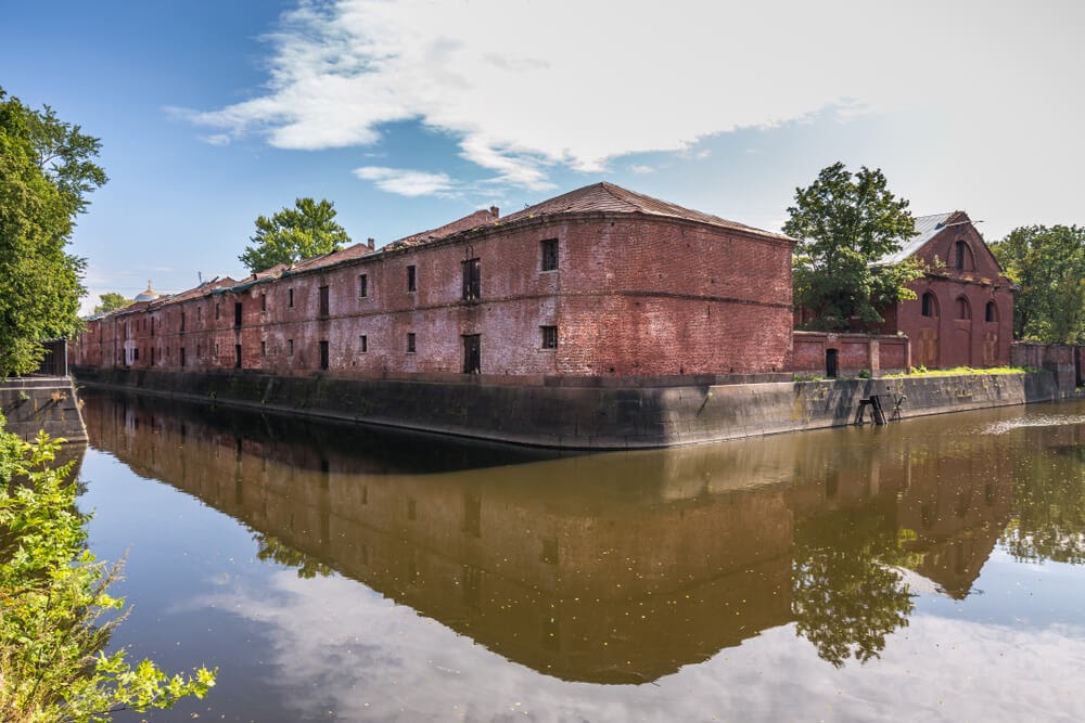 Obvodny Canal in Russia. Large brick building surrounded in water