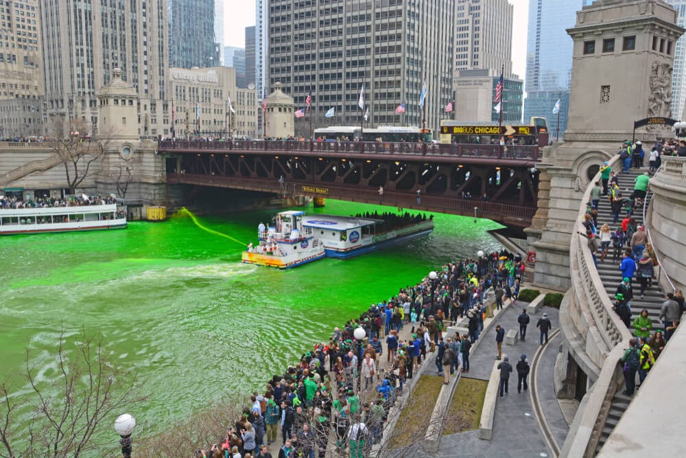 Chicago River dyed green surrounded by people