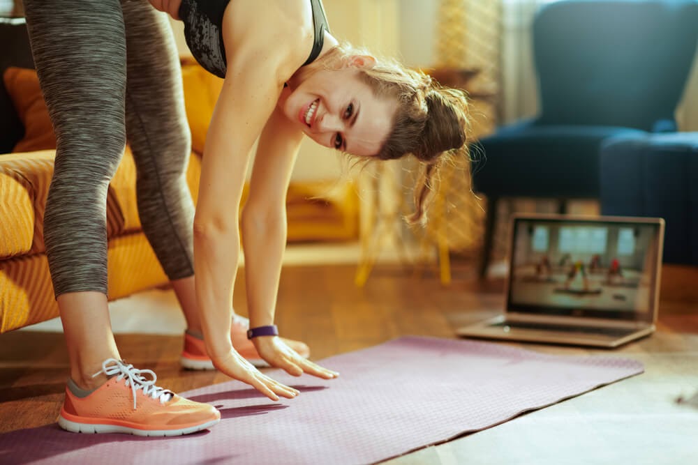 woman doing yoga at home