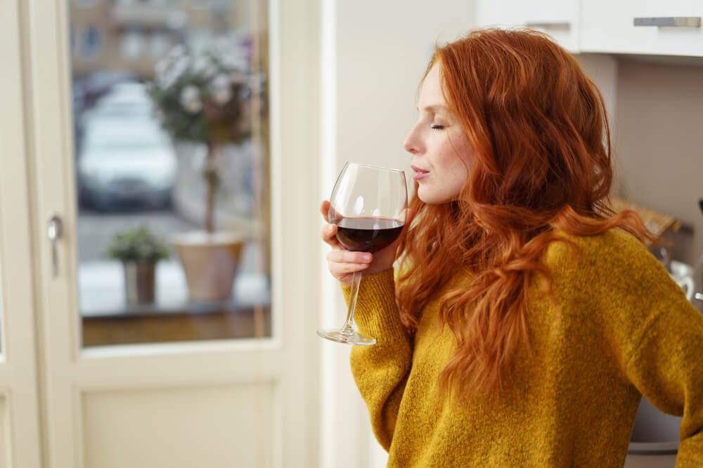 woman with glass of red wine