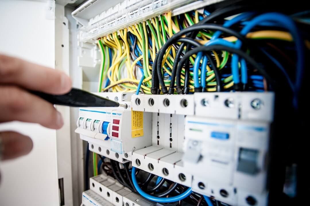 Close-up of wires and a small screwdriver.