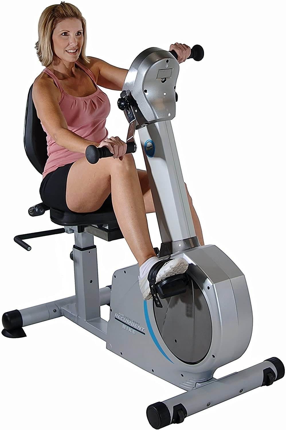 Woman on recumbent exercise bikes.