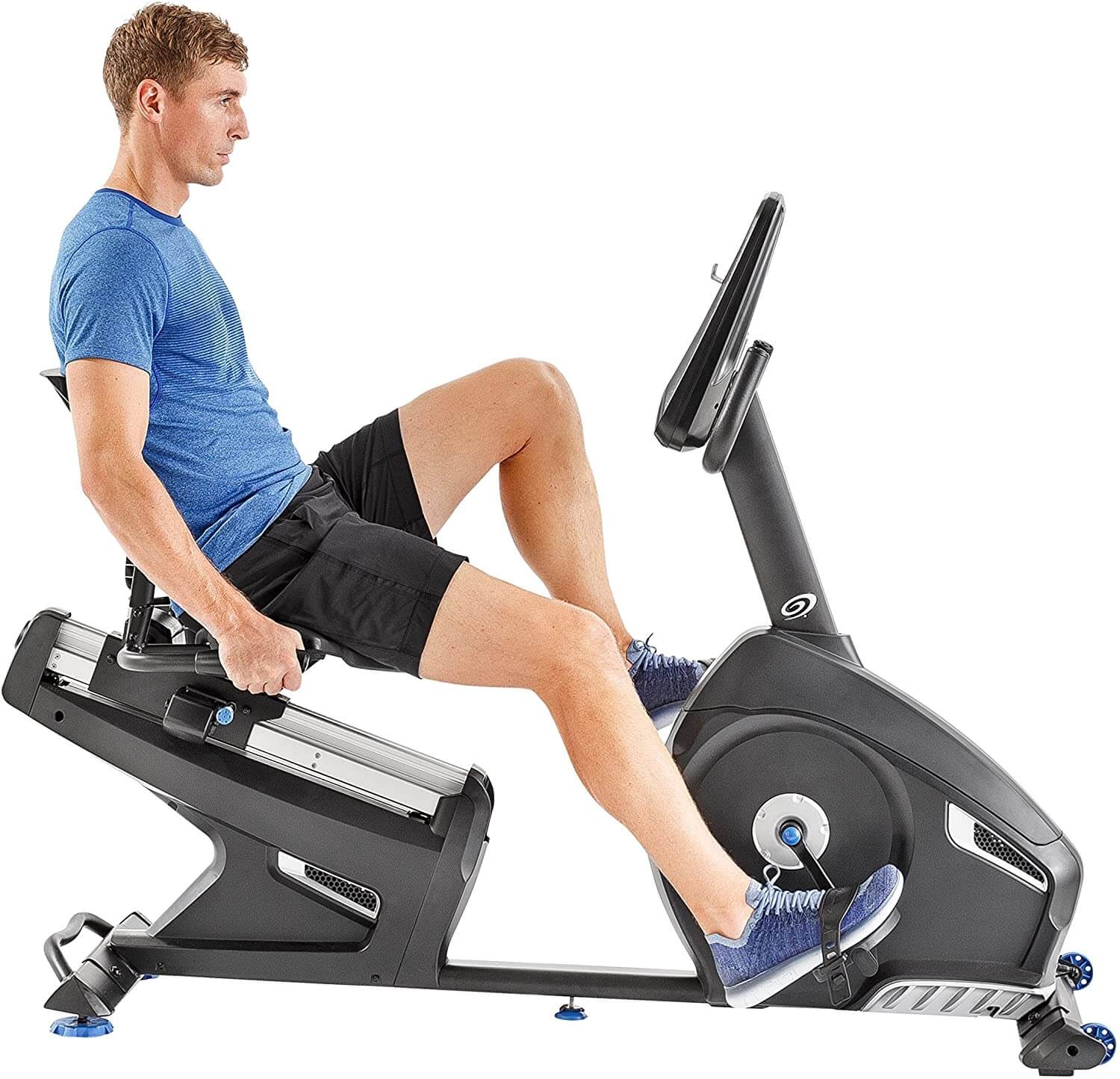 Man on recumbent exercise bike.