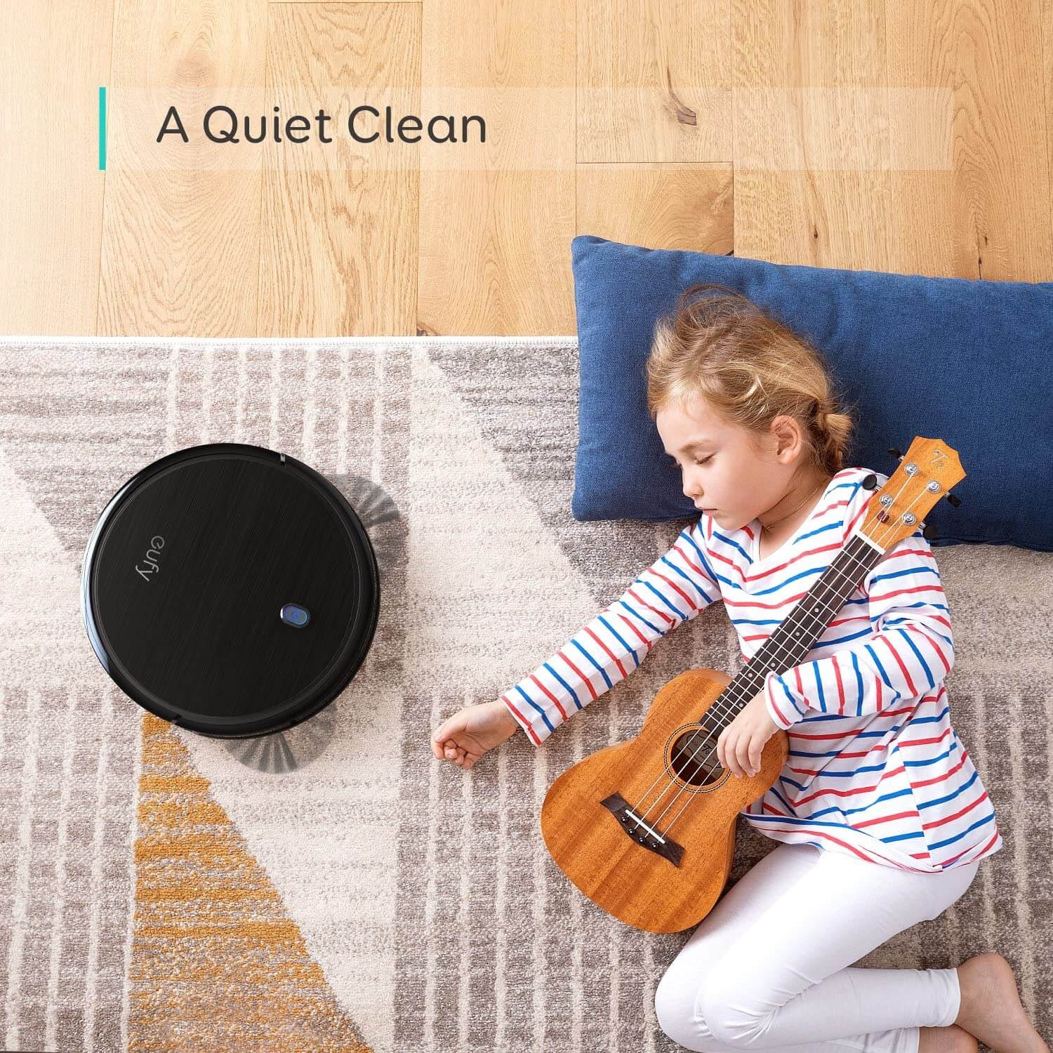 Eufy vacuum running next to a sleeping child.