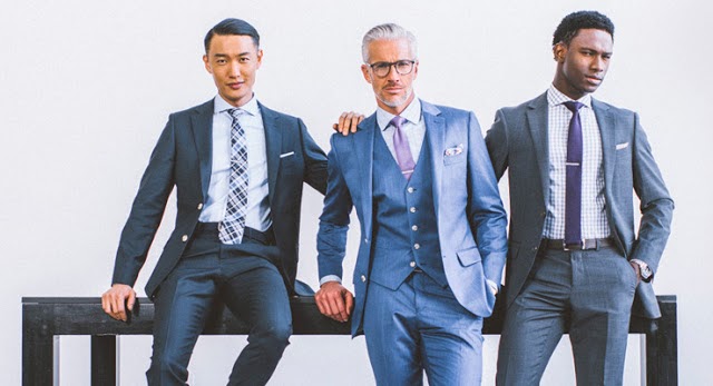 Indochino, three men in grey suits with pastel ties