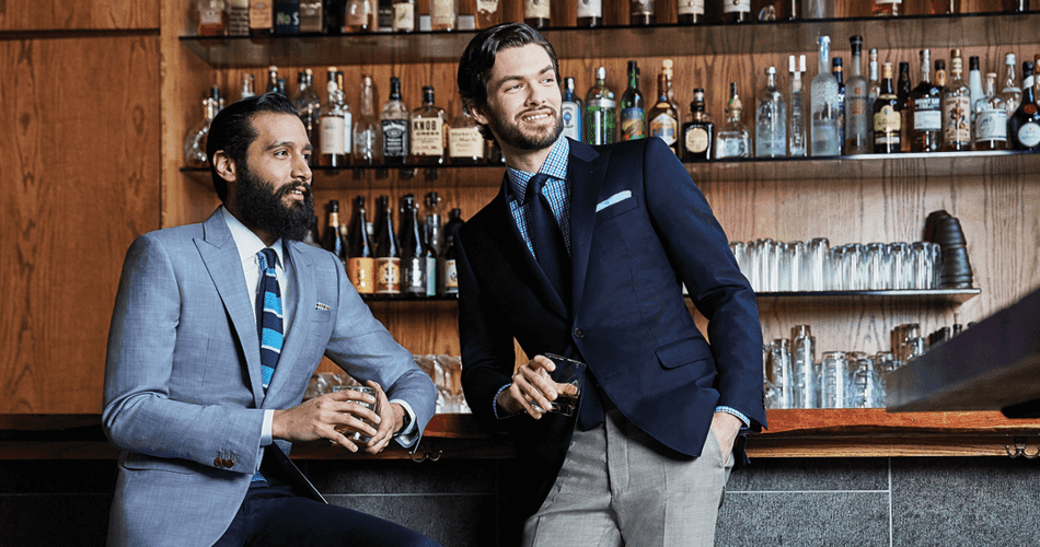 Black Lapel. two mean in suits at a bar