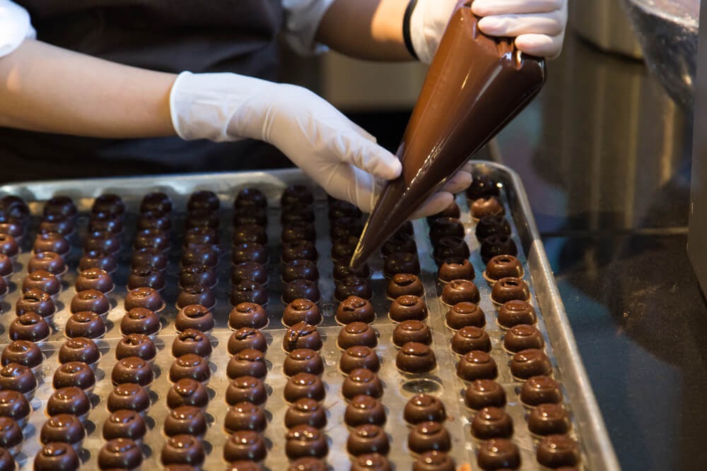 Chocolate maker fills chocolates