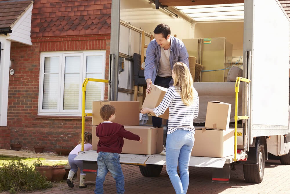 Family unloading a moving truck