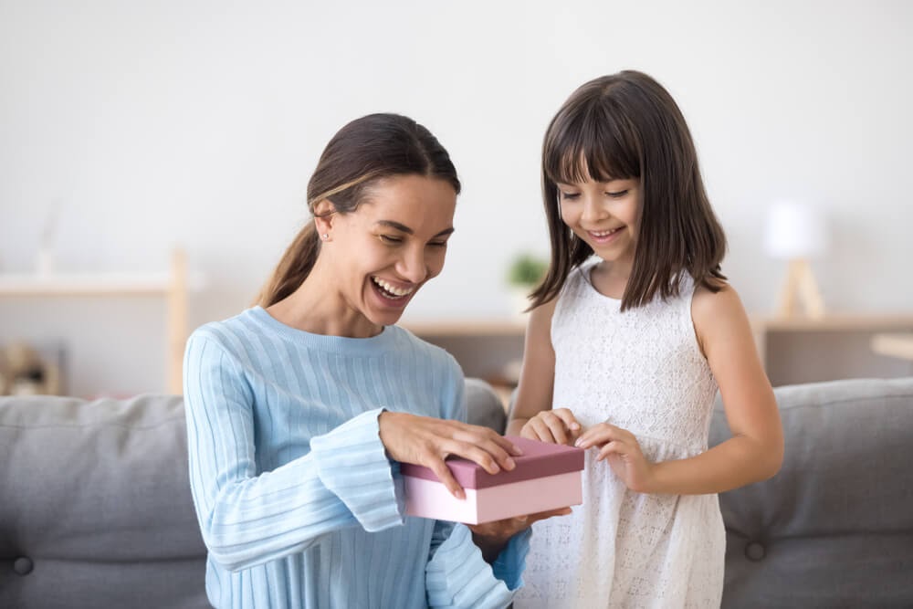 Woman opening box.