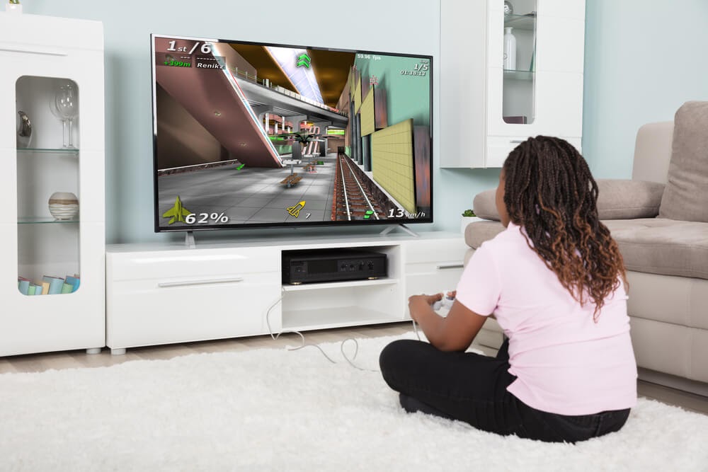 Young girl playing video games