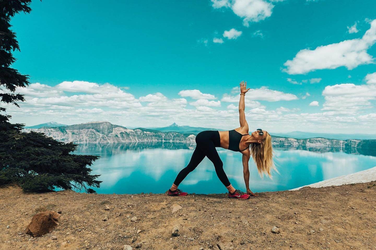 Woman doing yoga in front of Crater Lake.