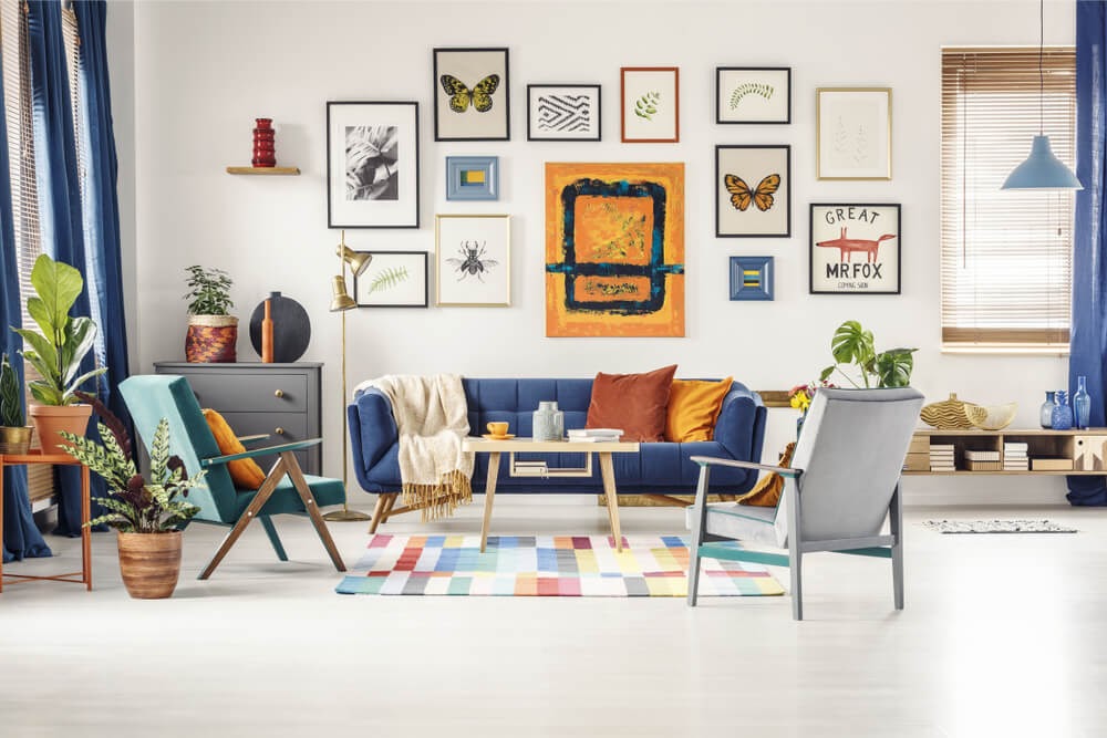 Eclectic living room design with funky wall art in blues and oranges.