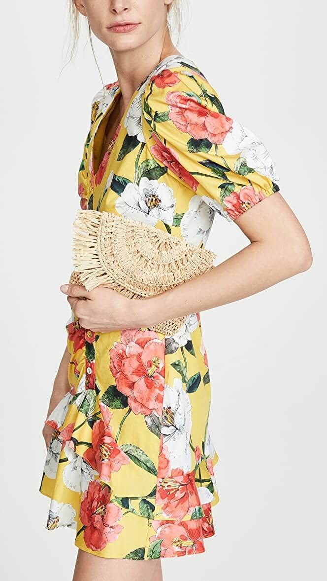 Woman in floral dress holds Mar Y Sol Women's Mia Mini Clutch
