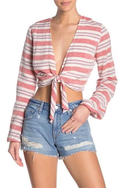 Lovers + Friends I Think I Love You Crop Top paired with jean shorts.
