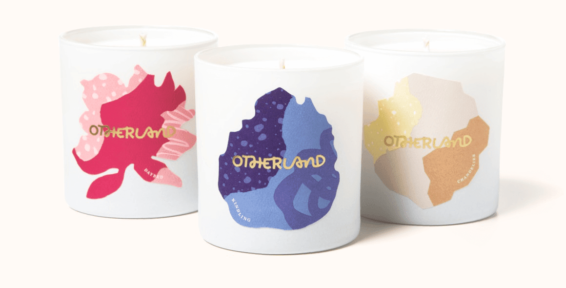 Fancy candle in pink, blue and gold tones.