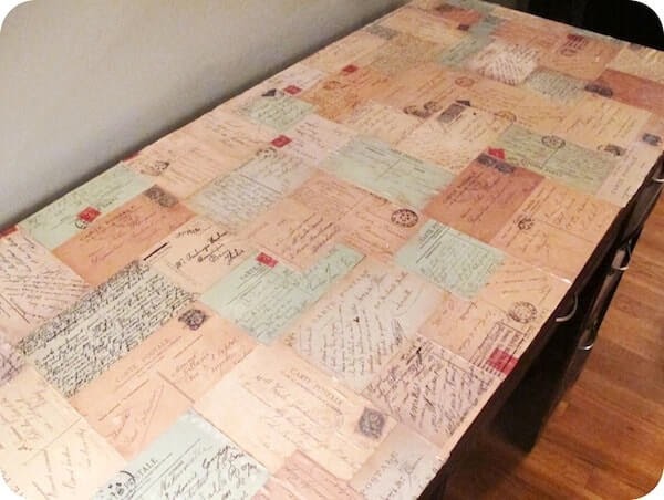 decorated desk with postcards