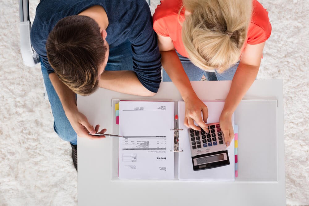 Man and woman looking over finances together