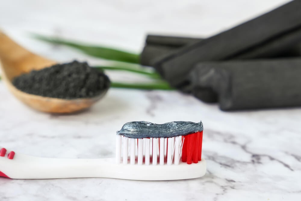 Activated charcoal on toothbrush