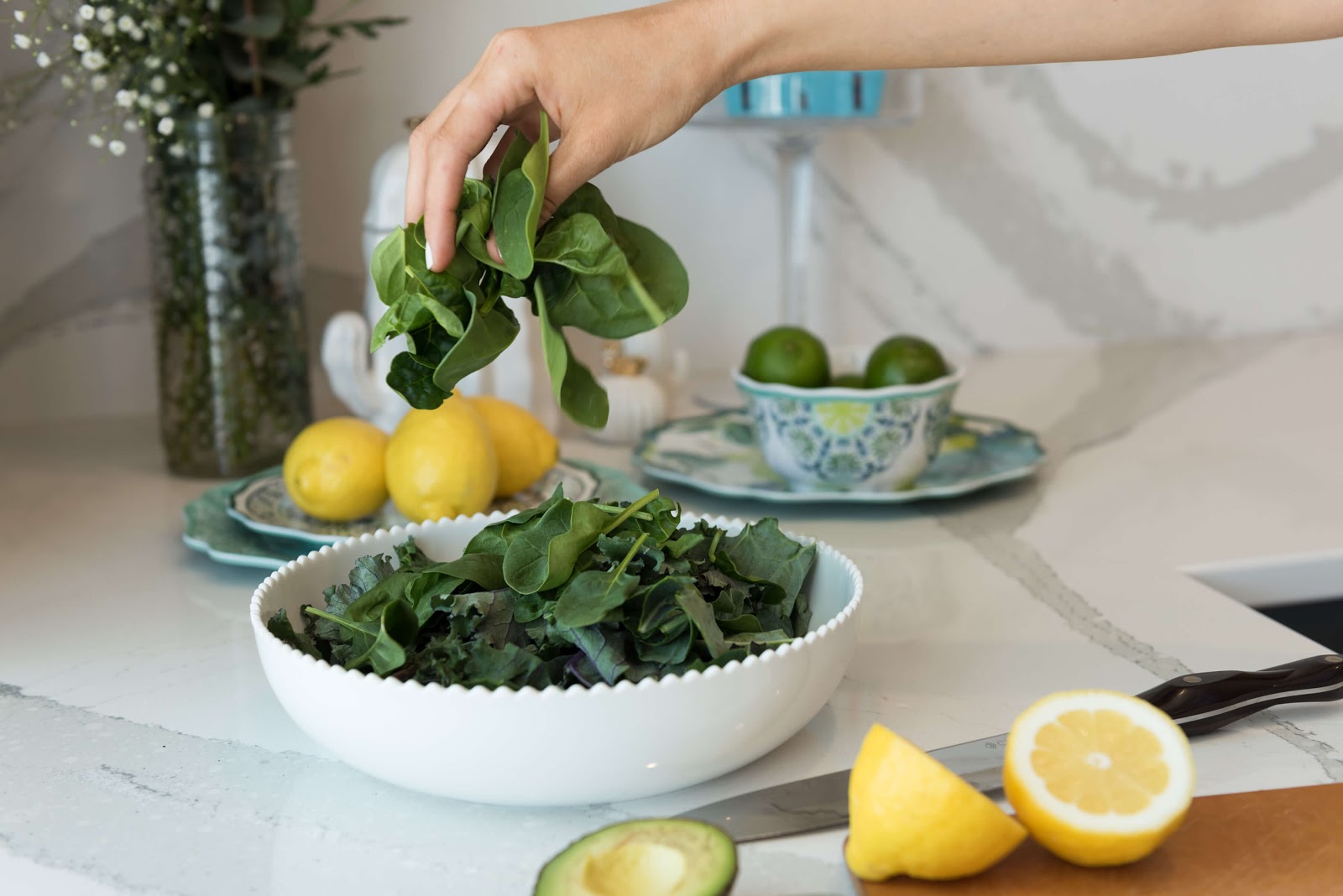 Woman grabbing a handful of lettuce