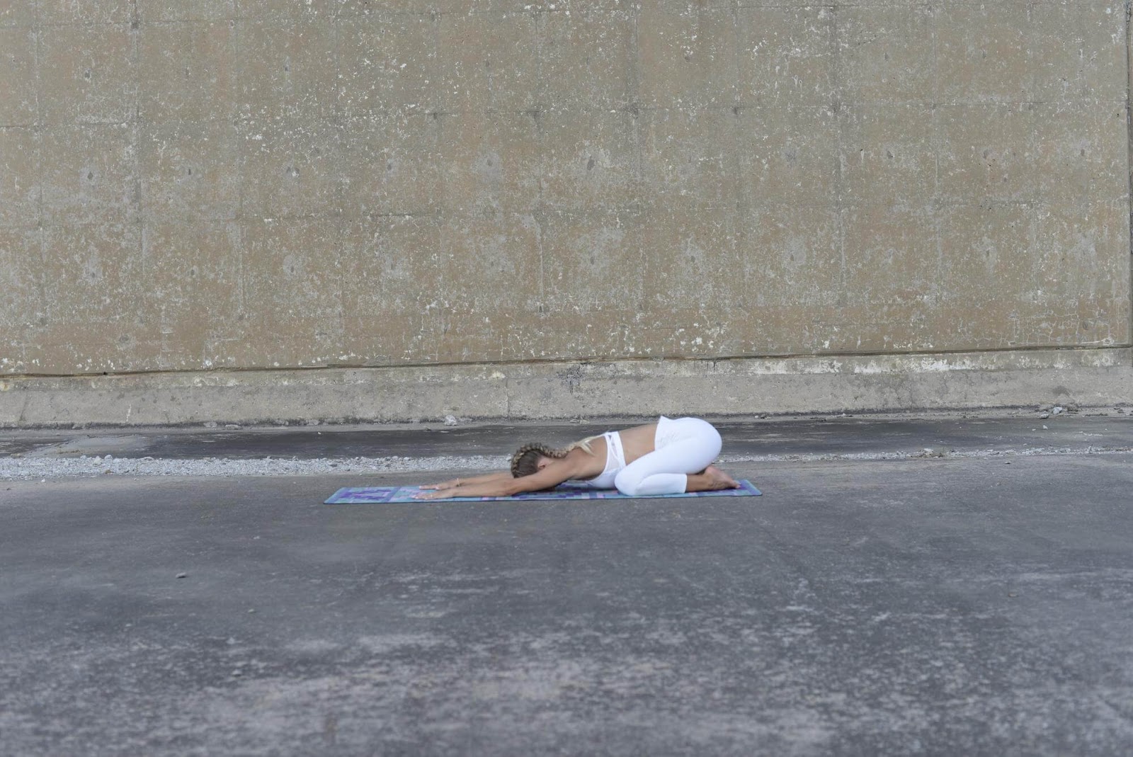Woman in child's pose position