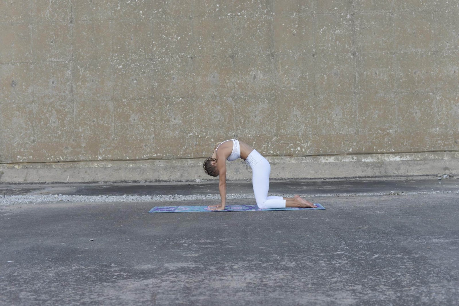 Woman doing cat pose