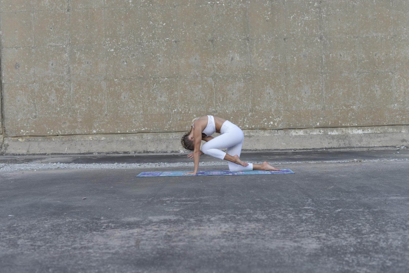 Woman in curled spinal balance position