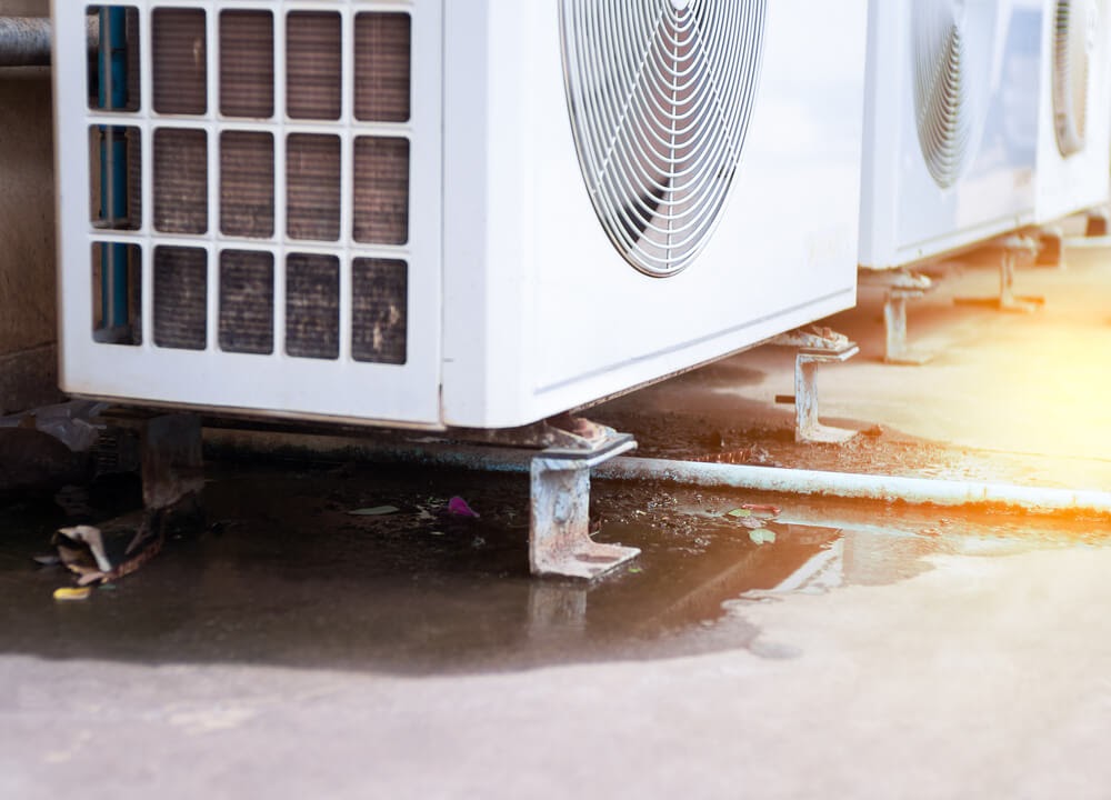 Close up of rusty a/c unit bottom caused by a leak