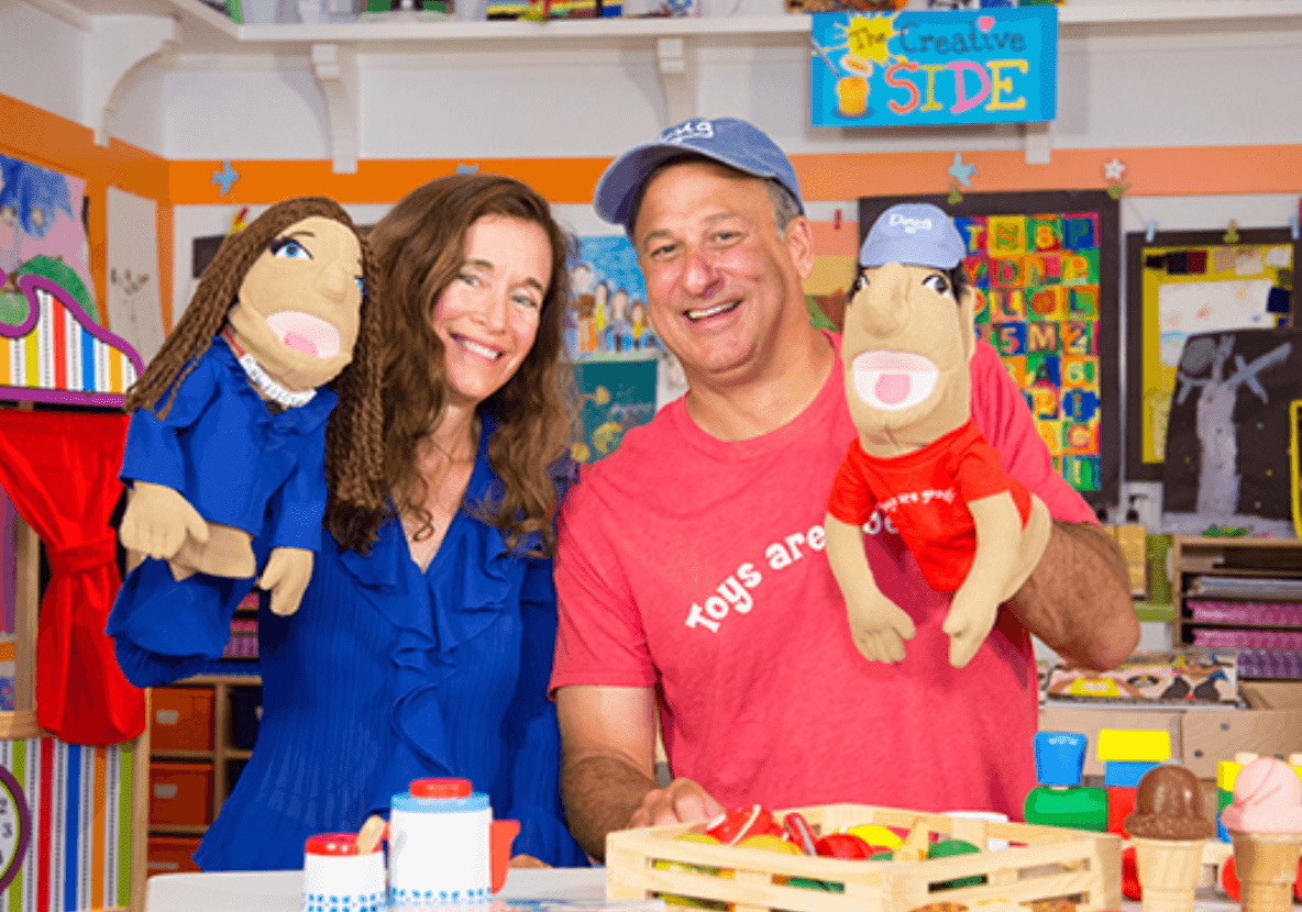 The actual Melissa & Doug with their look-alike puppets.