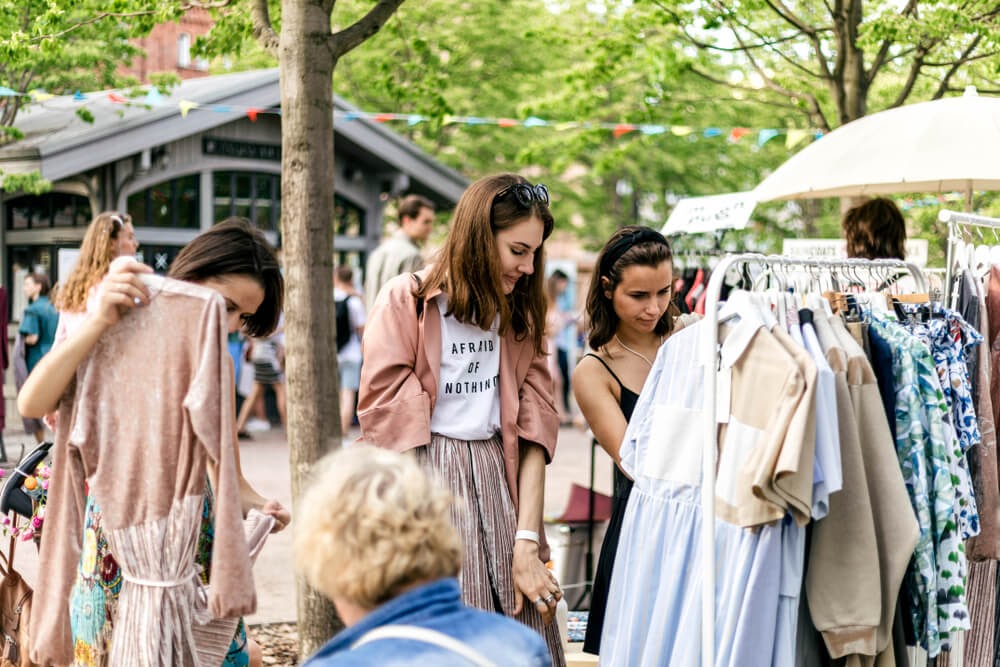 Ladies looking at clothes in a flea market