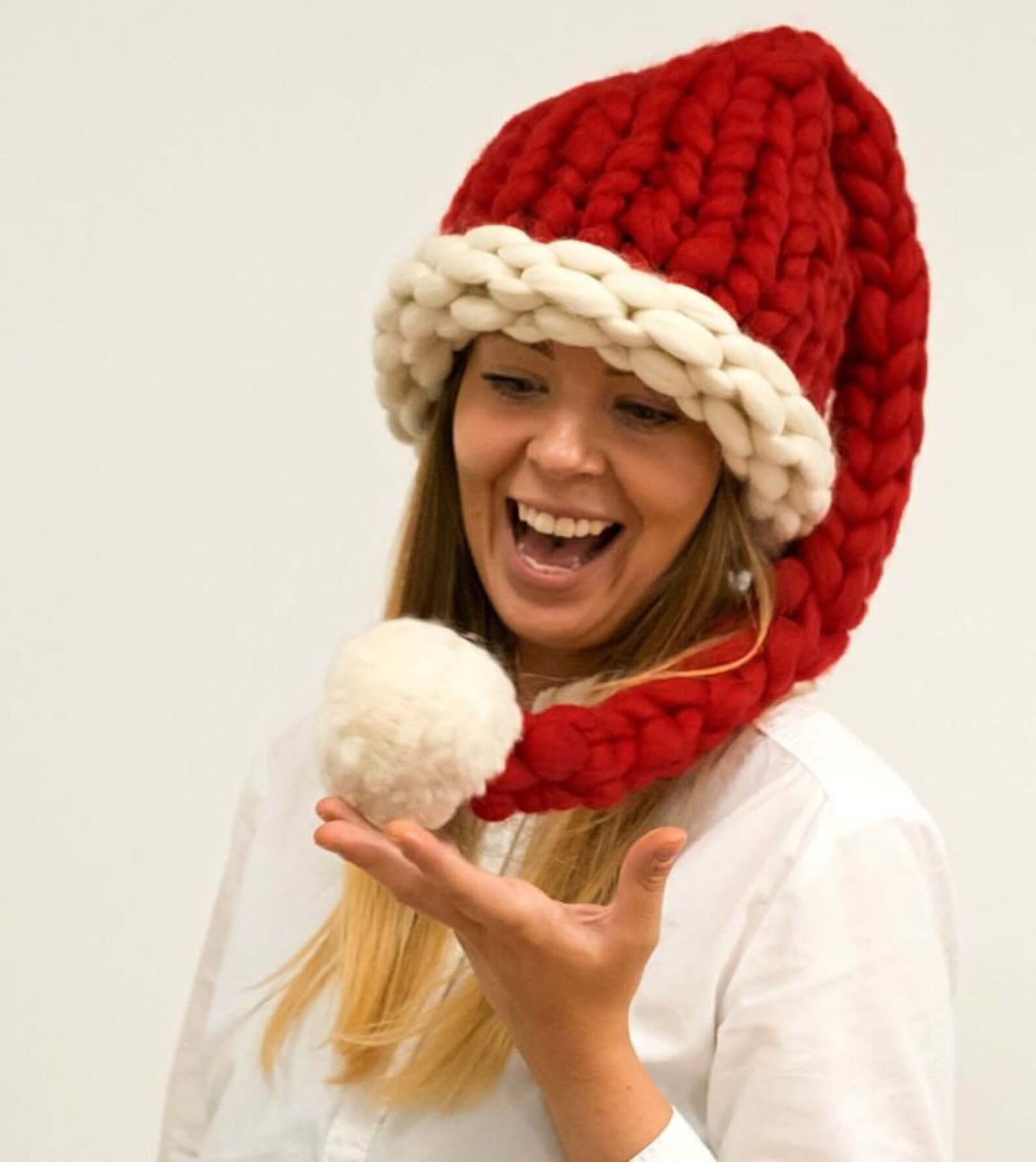 Woman rocking a chunky knit Santa hat