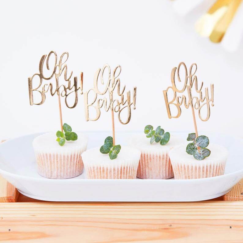 Cupcakes with "Oh Baby" toppers