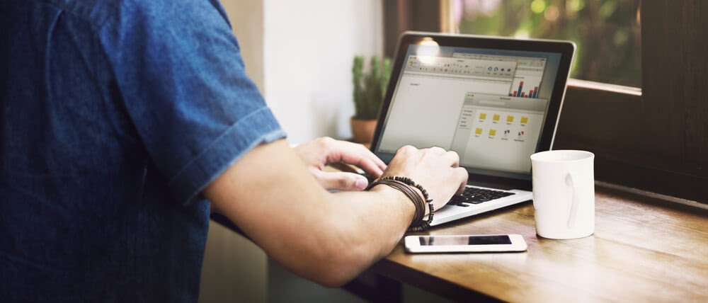 Man typing on laptop