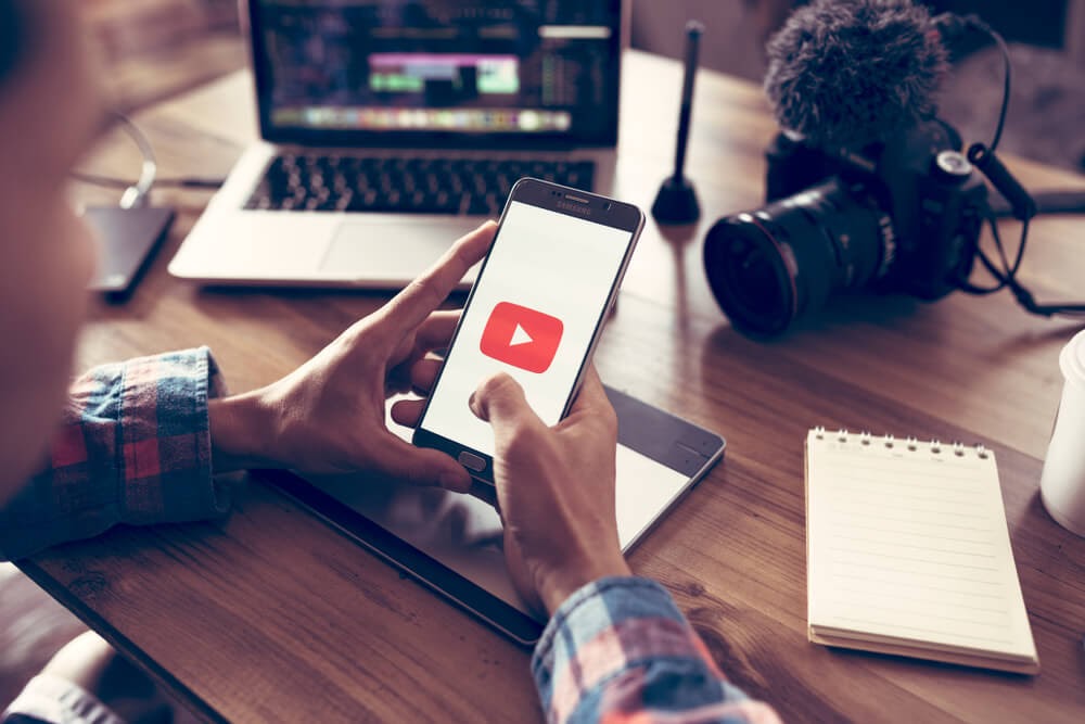 Man opening Youtube on his phone
