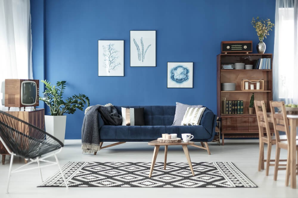 Mid-Century Modern living room against blue wall