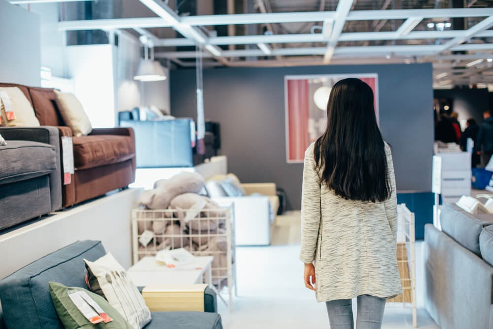 Woman walking through furniture store