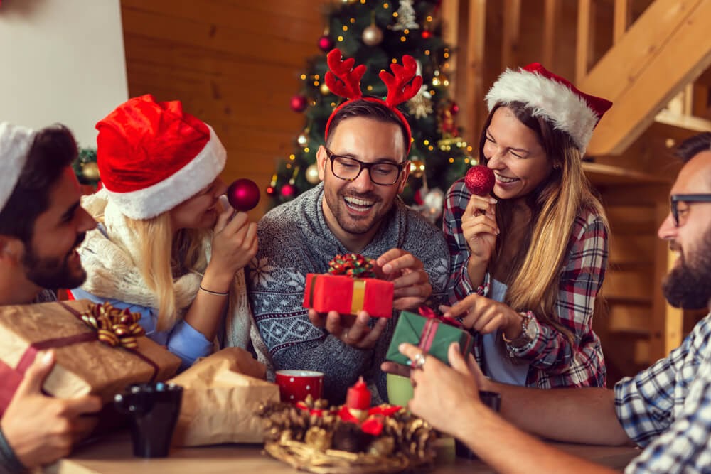 Friends sitting around, exchanging presents