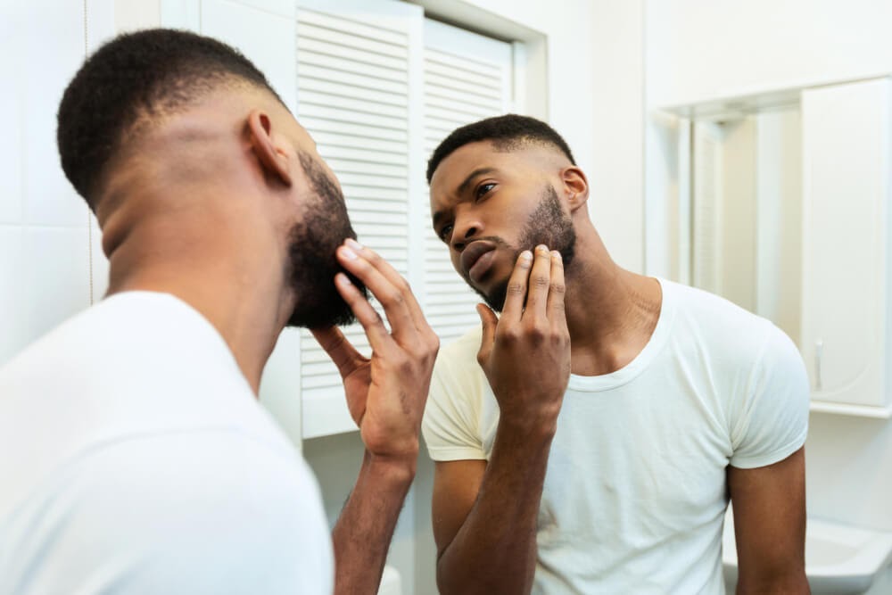 Man looking at himself in the mirror