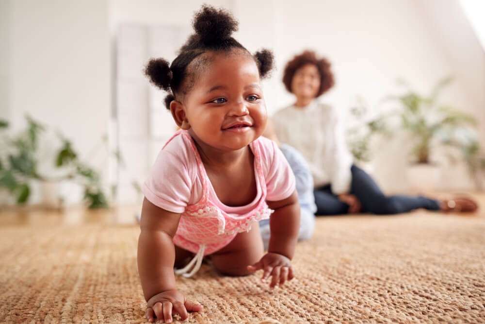 Baby girl crawling on the floor