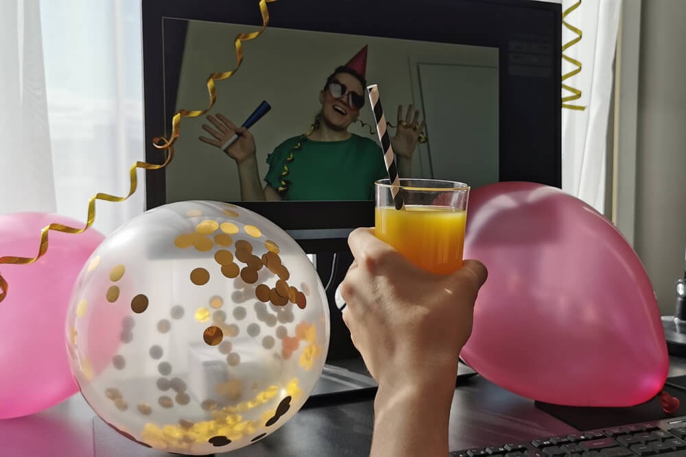 Balloons and streamers surrounding a virtual party