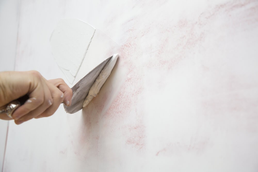 Close up of someone plastering the wall