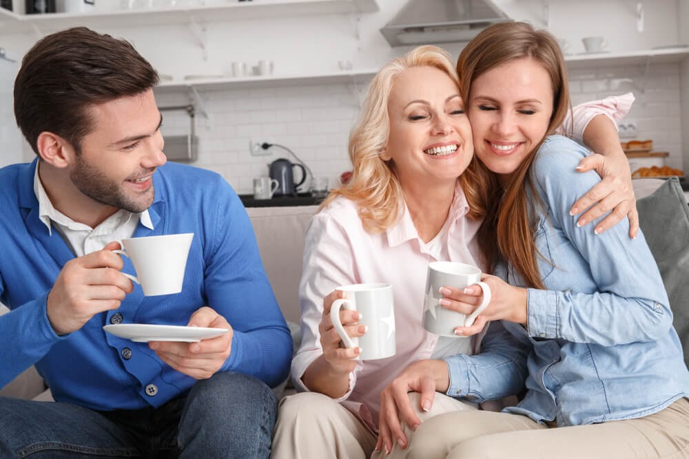 Woman snuggling on her daughter in law