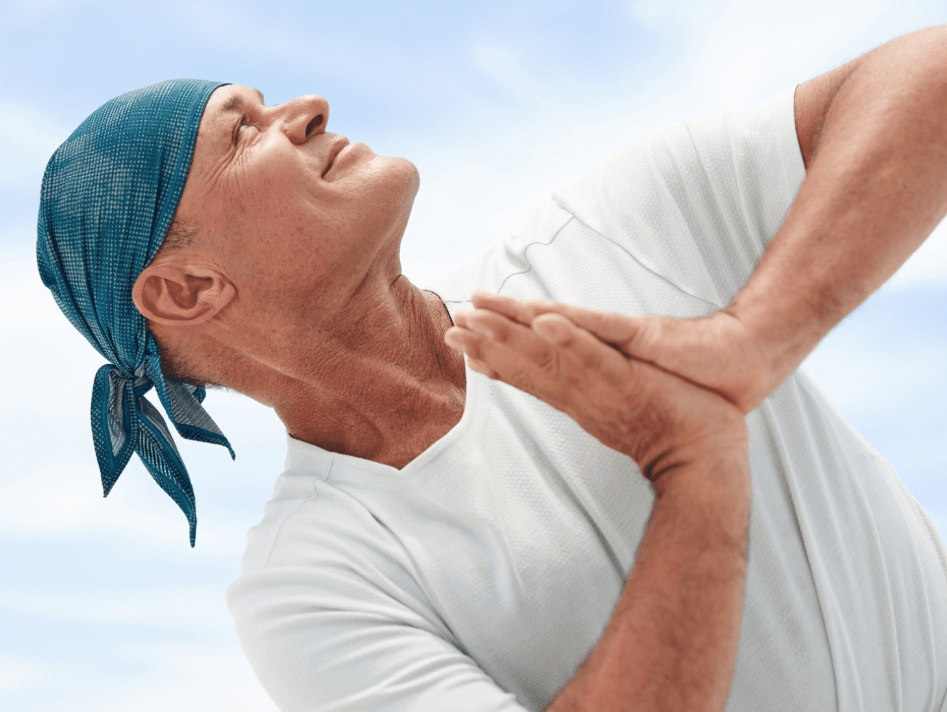 older man doing yoga