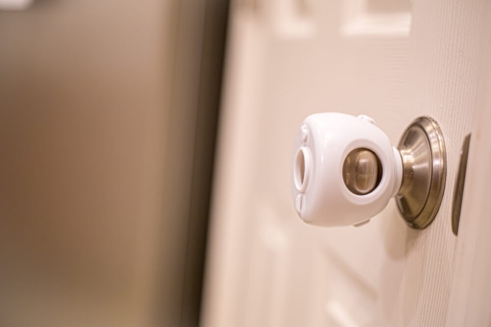 Doorknob with childproof attachment
