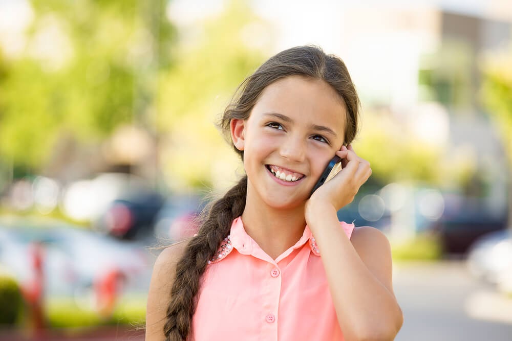 Young girl talking on a cell phone