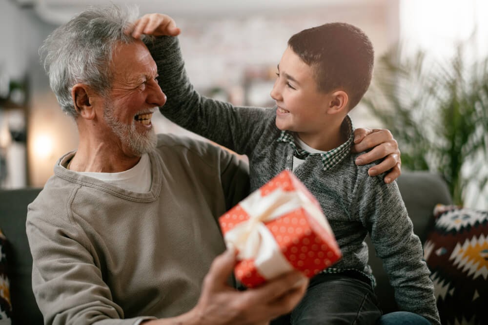 Boy sitting on grandpa's lap