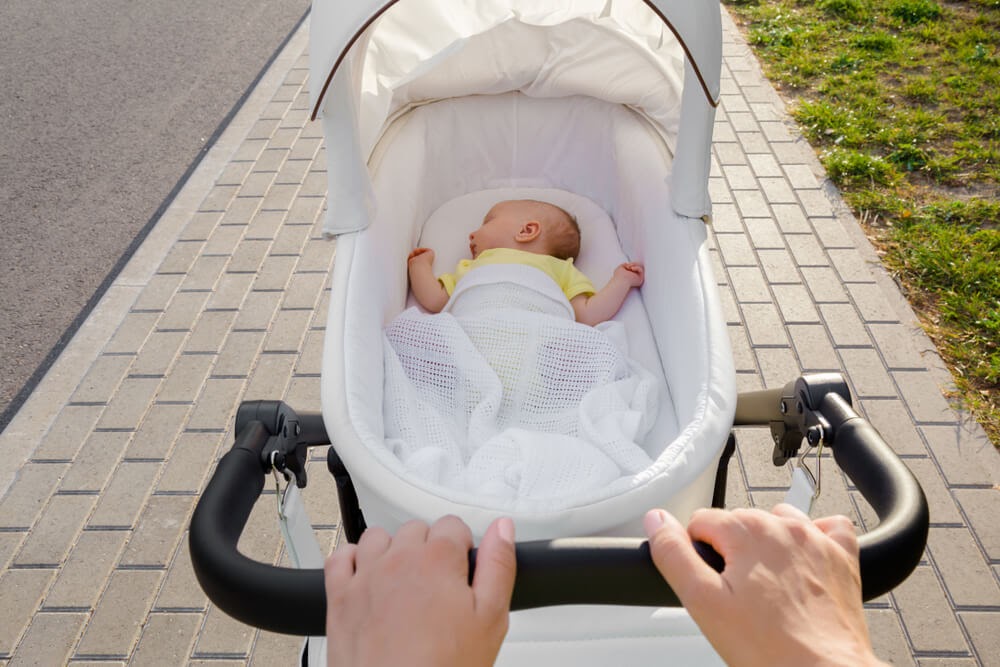 Baby sleeping in a stroller