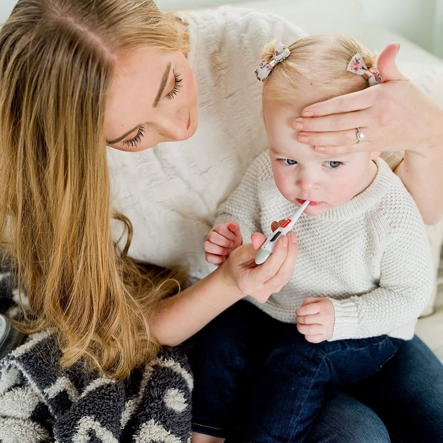Mom checking her baby's temperature