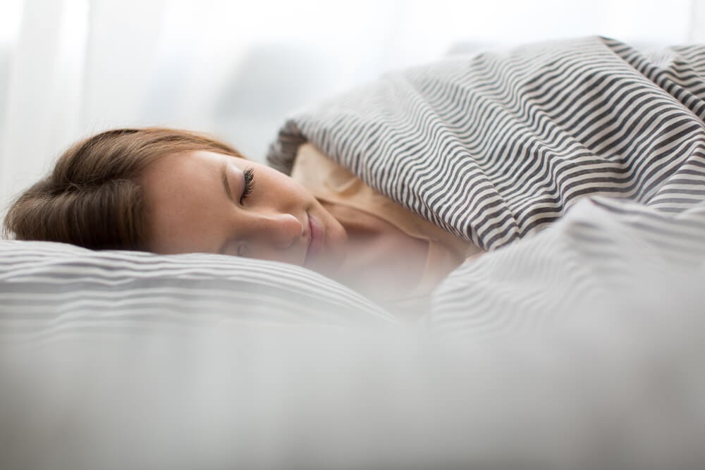 Woman sleeping in bed